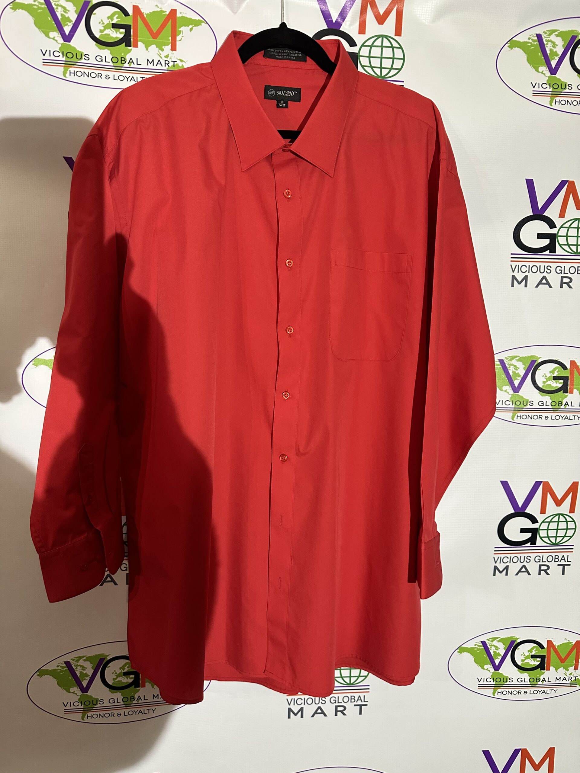 A Milani Dress Shirt hanging on a hanger with a logo on it.